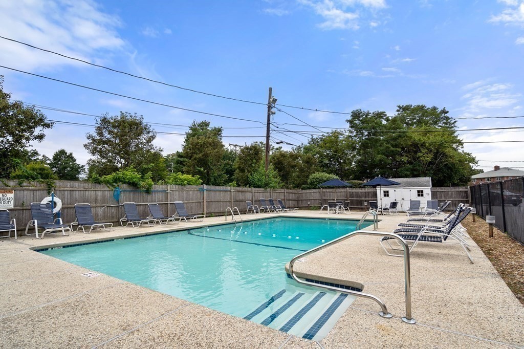 32 Whitman Road, Unit 14 Waltham, MA 02453 - Photo 19 of 20 a view of a patio with swimming pool
