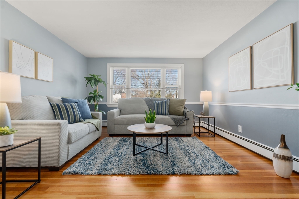 32 Whitman Road, Unit 14 Waltham, MA 02453 - Photo 2 of 20 a living room with furniture and a rug