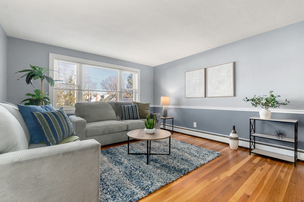 32 Whitman Road, Unit 14 Waltham, MA 02453 - Photo 3 of 20 a living room with furniture and a potted plant