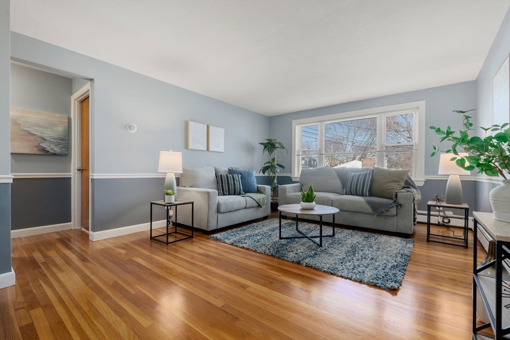 32 Whitman Road, Unit 14 Waltham, MA 02453 - Photo 9 of 20 a living room with furniture and a wooden floor