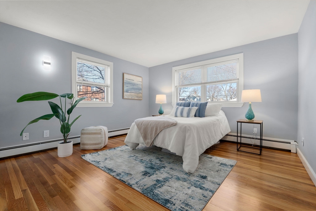 32 Whitman Road, Unit 14 Waltham, MA 02453 - Photo 10 of 20 a bedroom with a bed window and couch