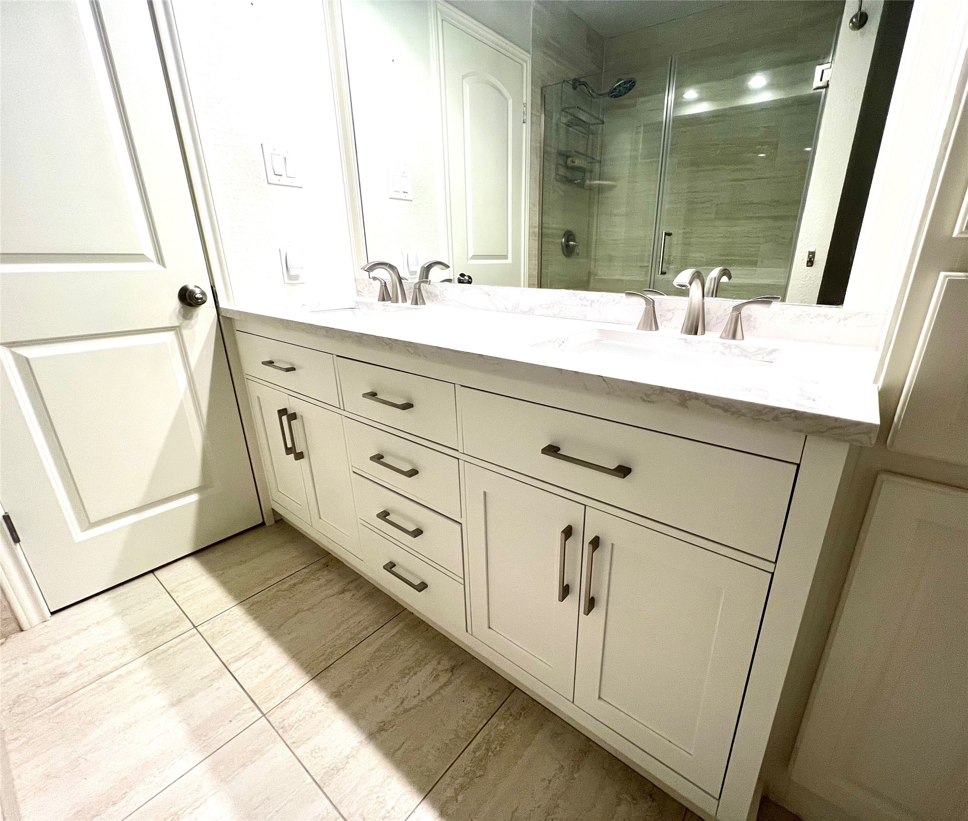 8810 Mountain Path Circle Austin, TX 78759 - Photo 11 of 37 Bathroom with double vanity and a shower stall