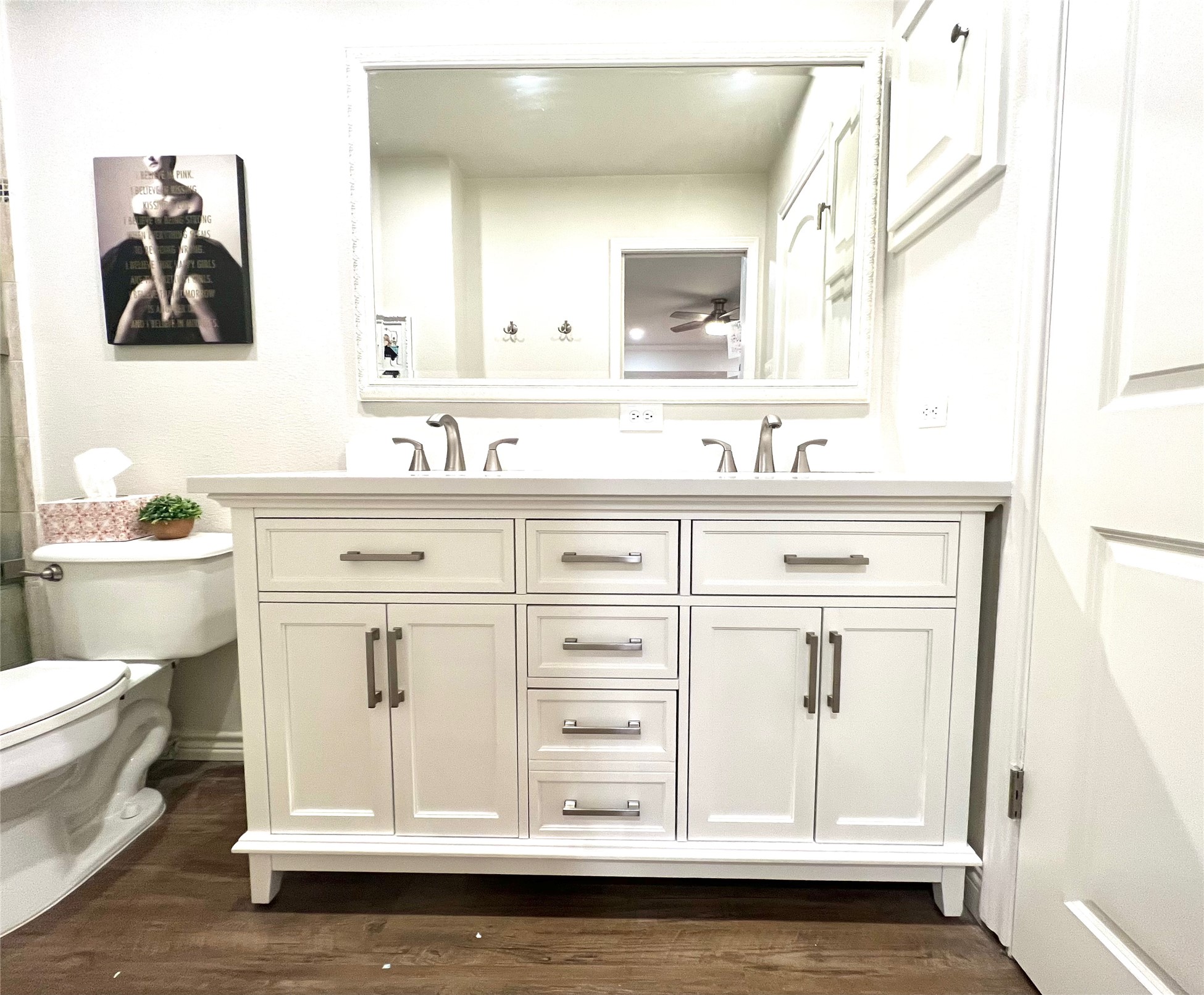 8810 Mountain Path Circle Austin, TX 78759 - Photo 17 of 37 Bathroom with double vanity, dark wood-type flooring, and a shower