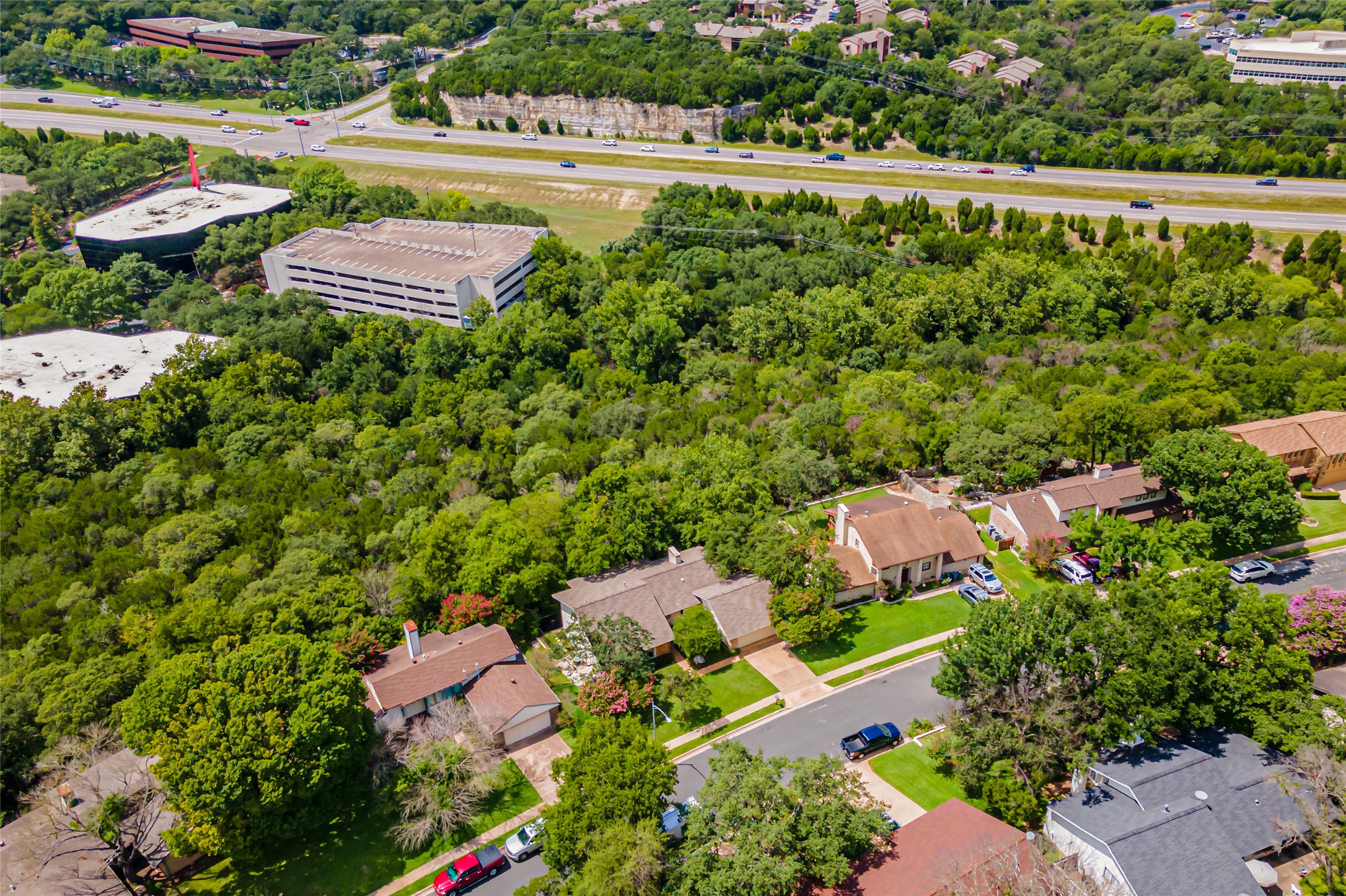 8810 Mountain Path Circle Austin, TX 78759 - Photo 33 of 37 Aerial view of property and surrounding area featuring nearby suburban area