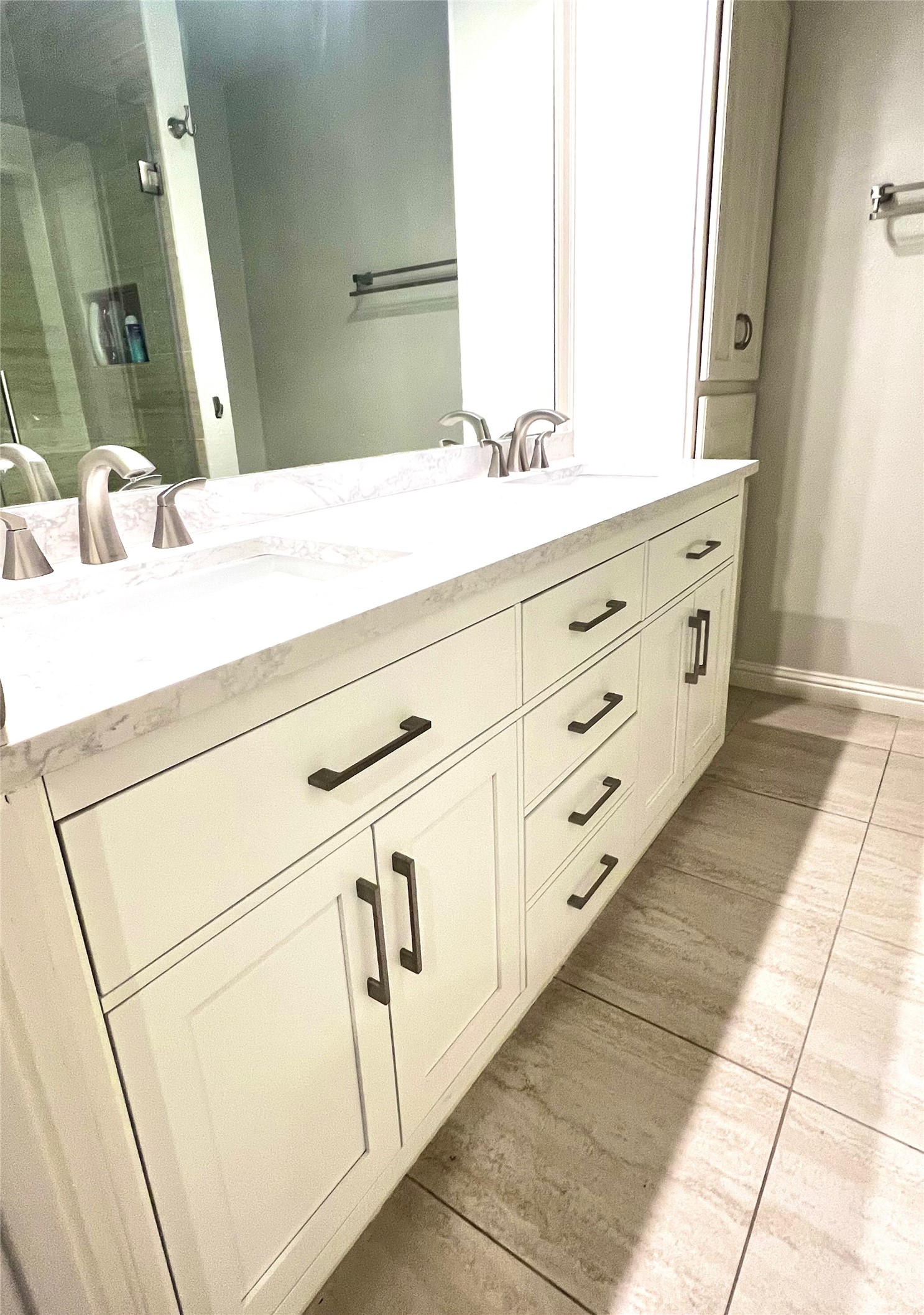 8810 Mountain Path Circle Austin, TX 78759 - Photo 36 of 37 Bathroom with double vanity and a shower with shower door