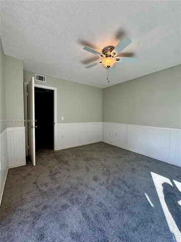 a bathroom with a shower and a toilet