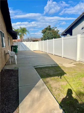 a view of a backyard of the house