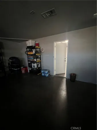 a bed room with a bed and a chair