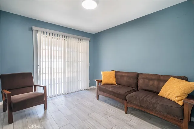 a view of livingroom with hardwood floor and a ceiling fan