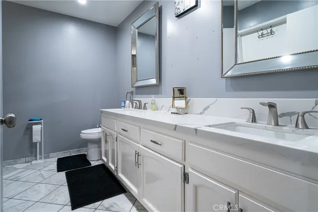 a bedroom with a bed and dresser