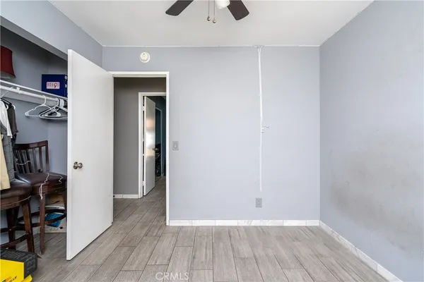 a view of livingroom with hardwood floor and a ceiling fan