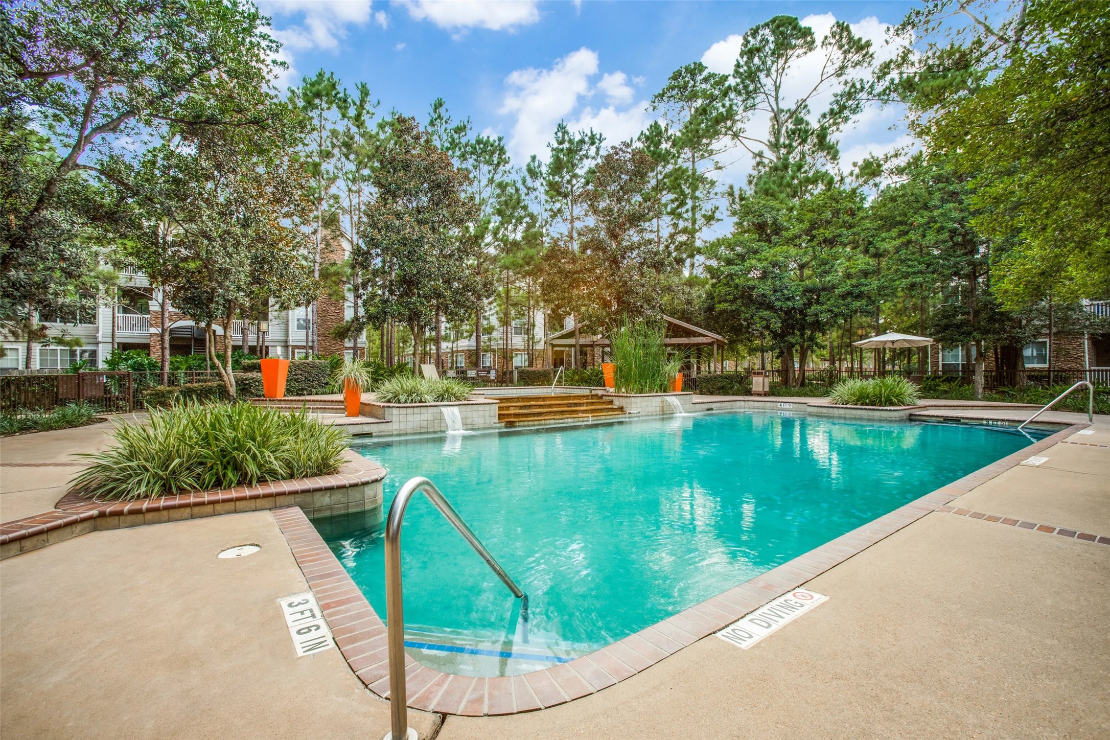 10221 Centrepark Drive, Unit B1732 Houston, TX 77043 - Photo 16 of 16 a view of a swimming pool with a patio