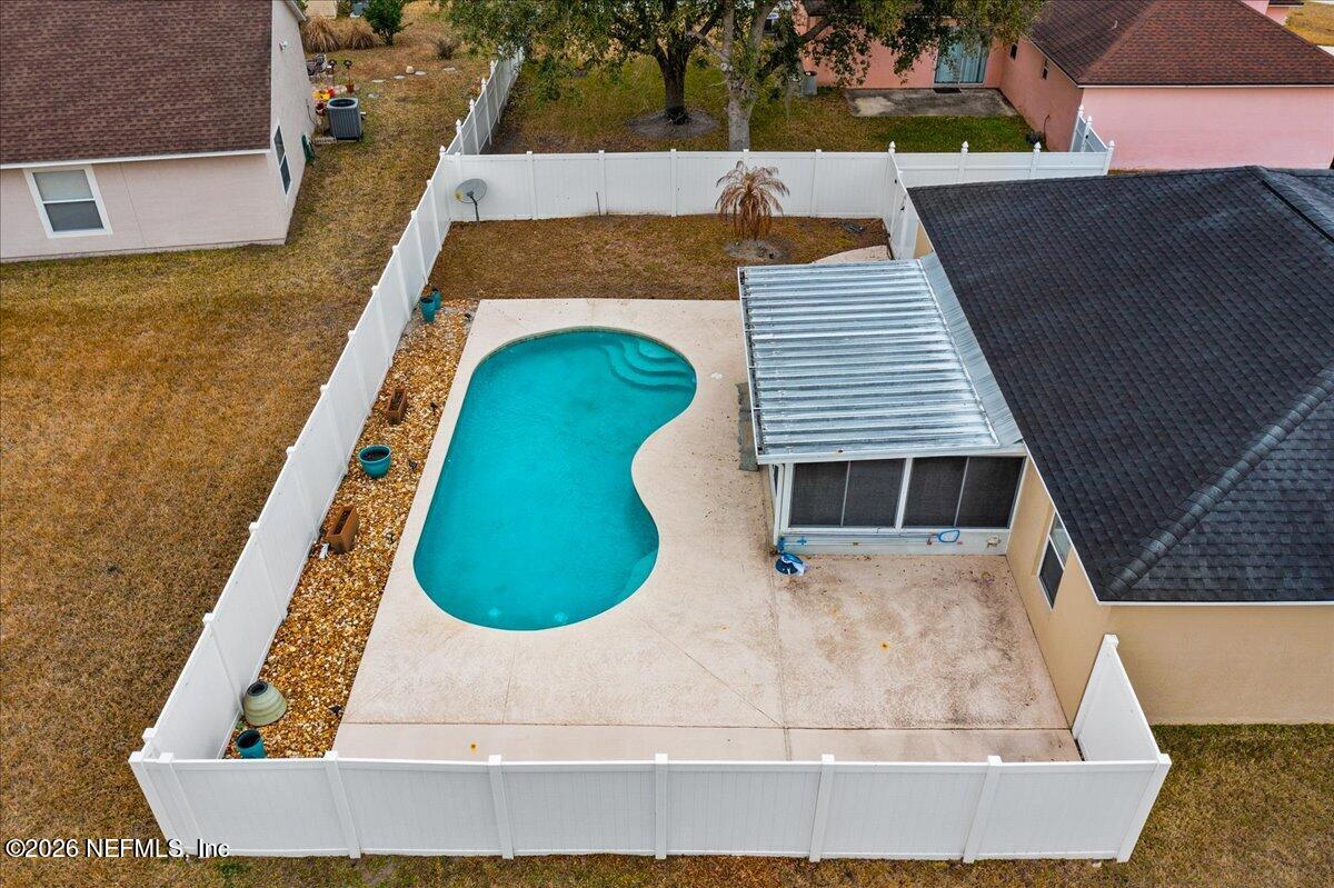 10310 Woodley Point Road Jacksonville, FL 32218 - Photo 26 of 30 an aerial view of a house with swimming pool