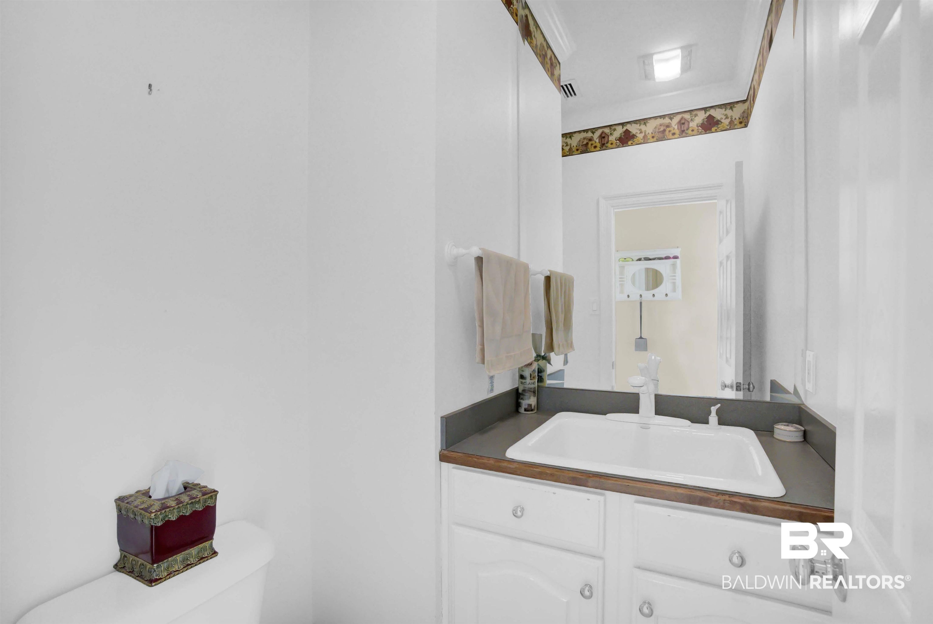 27688 Rigsby Road Daphne, AL 36526 - Photo 23 of 56 Bathroom featuring toilet, ornamental molding, and vanity