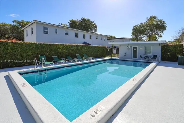 a view of a swimming pool with a patio