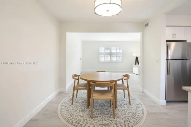 a view of a livingroom with furniture and a window