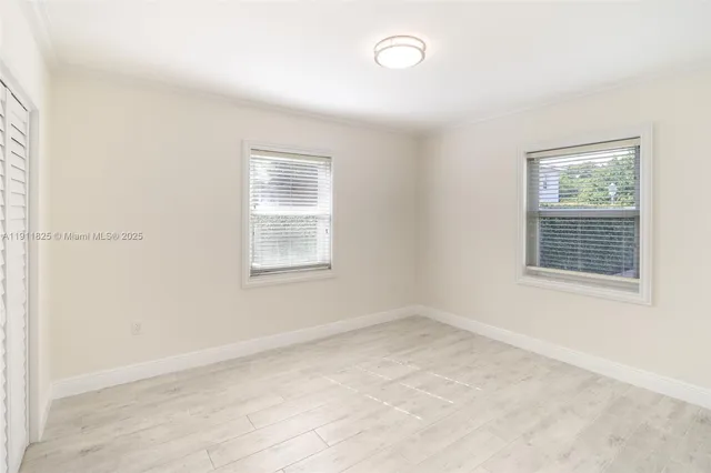 an empty room with windows