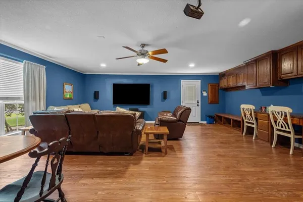 a kitchen with granite countertop a sink a counter top space appliances and cabinets