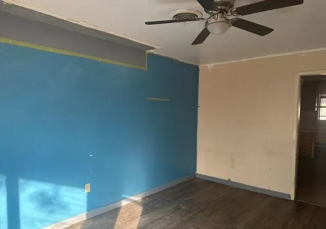 a view of a small space with wooden floor