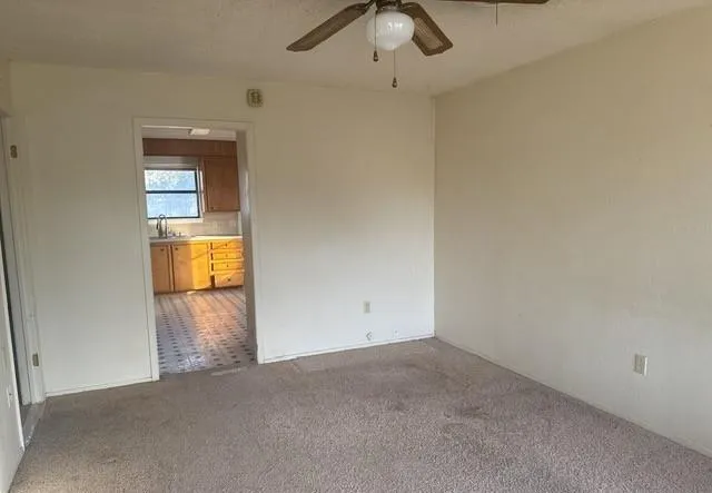 an empty room with a empty space and windows