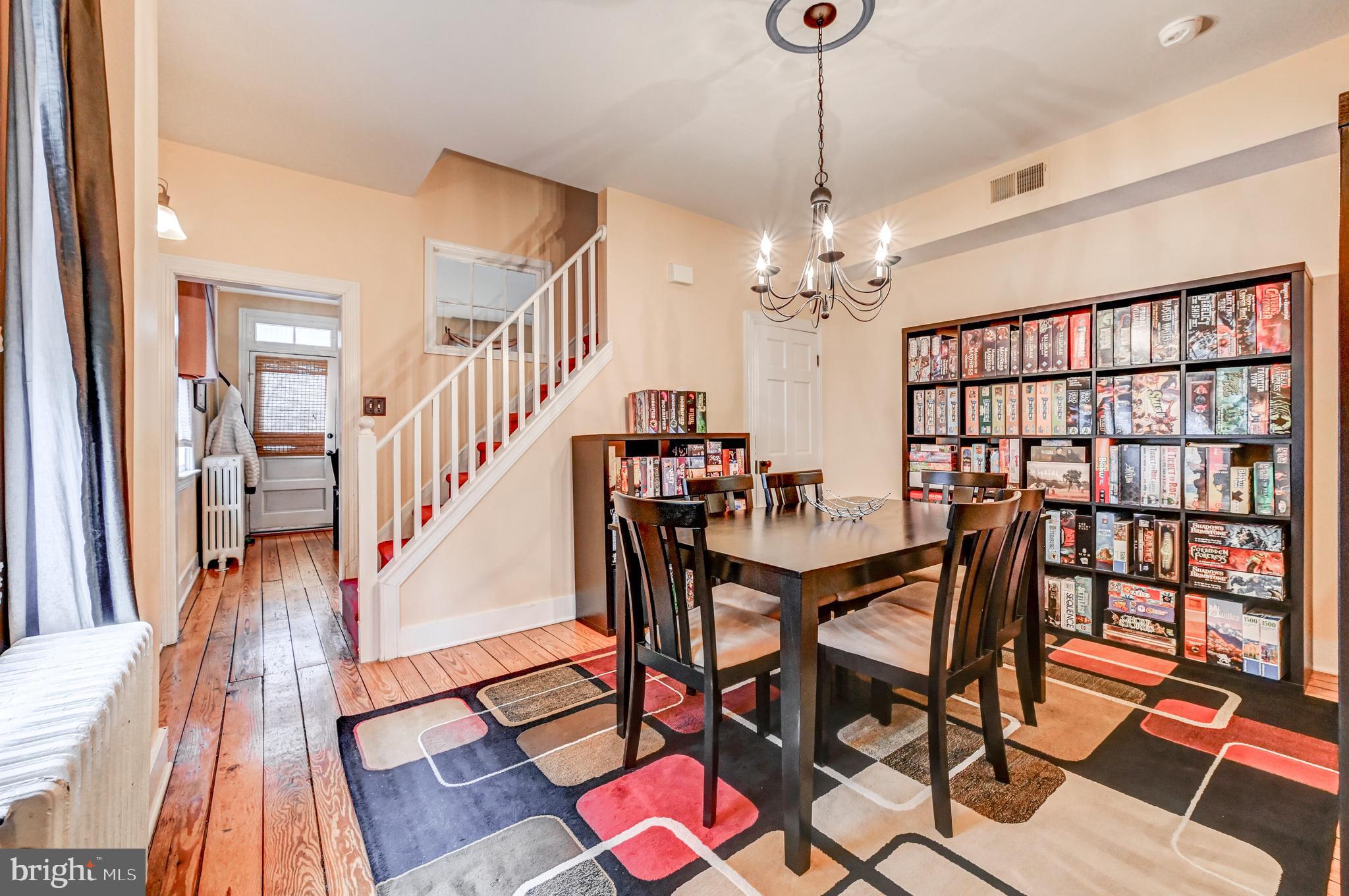 715 Pleasant Hill Road Ellicott City, MD 21043 - Photo 11 of 27 a view of a dining room with furniture wooden floor and chandelier