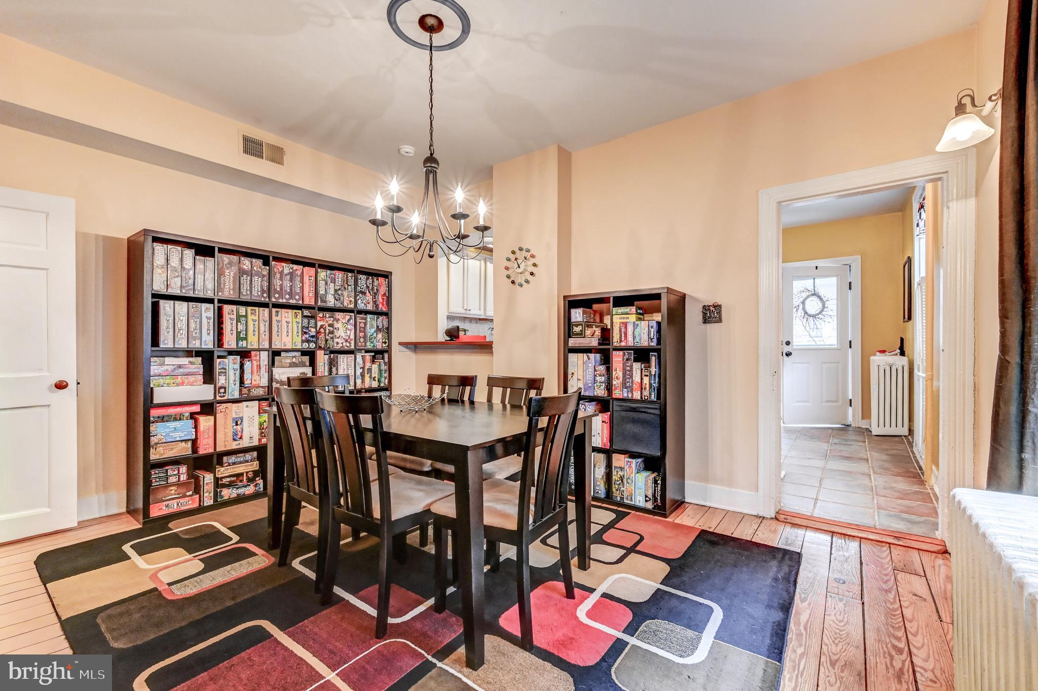 715 Pleasant Hill Road Ellicott City, MD 21043 - Photo 12 of 27 a view of a dining room with furniture and wooden floor