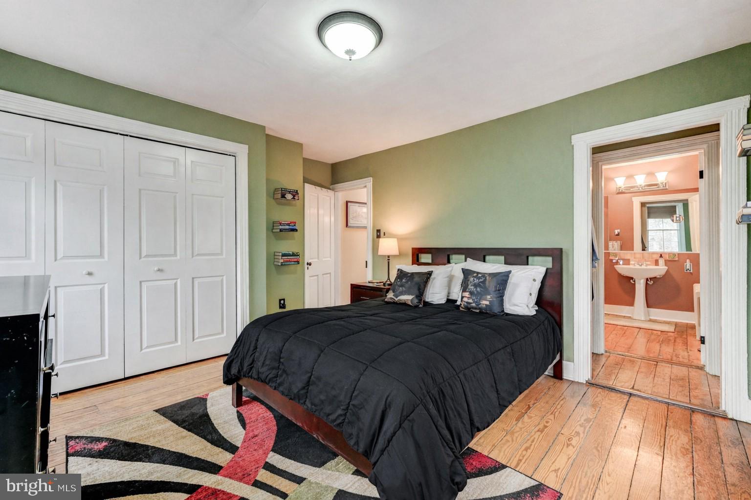 715 Pleasant Hill Road Ellicott City, MD 21043 - Photo 16 of 27 a bedroom with a bed and a mirror
