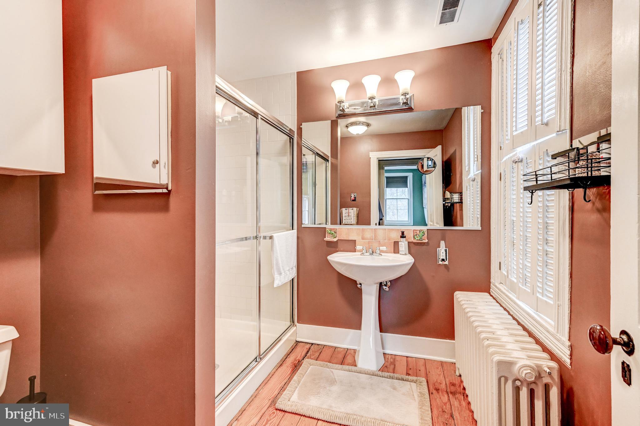 715 Pleasant Hill Road Ellicott City, MD 21043 - Photo 17 of 27 a view of a bathroom with a sink and mirror