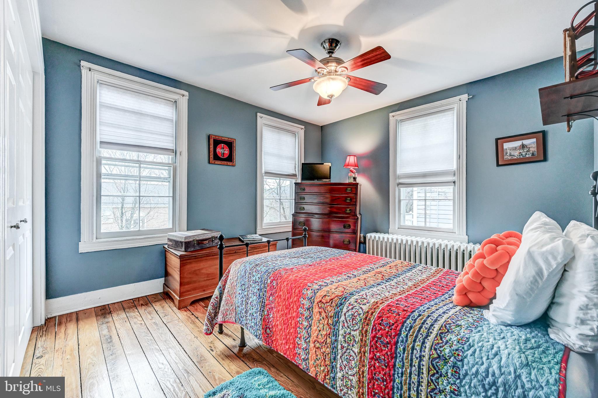 715 Pleasant Hill Road Ellicott City, MD 21043 - Photo 20 of 27 a bedroom with a bed and a chandelier