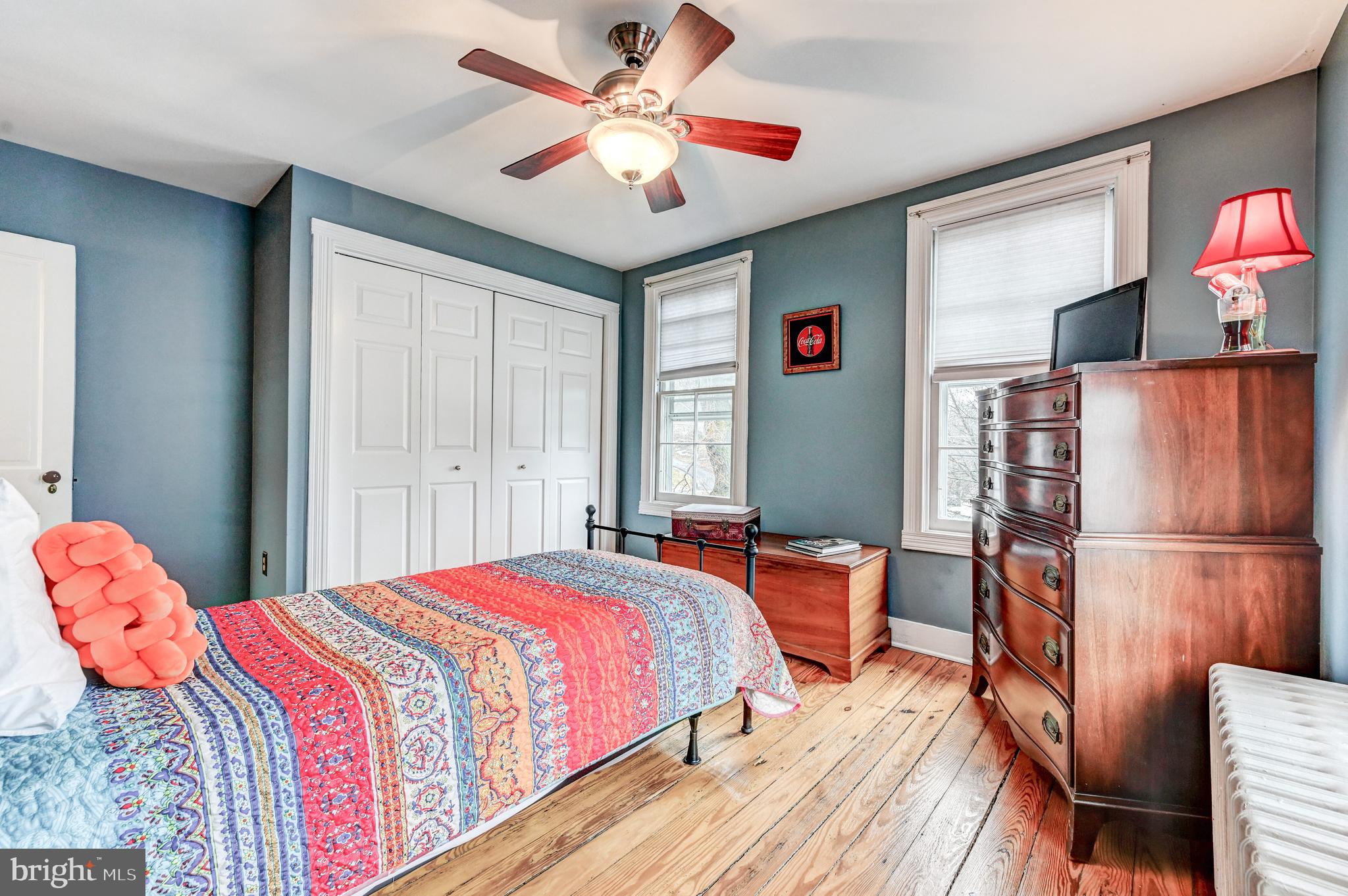 715 Pleasant Hill Road Ellicott City, MD 21043 - Photo 21 of 27 a bedroom with a bed and a chandelier