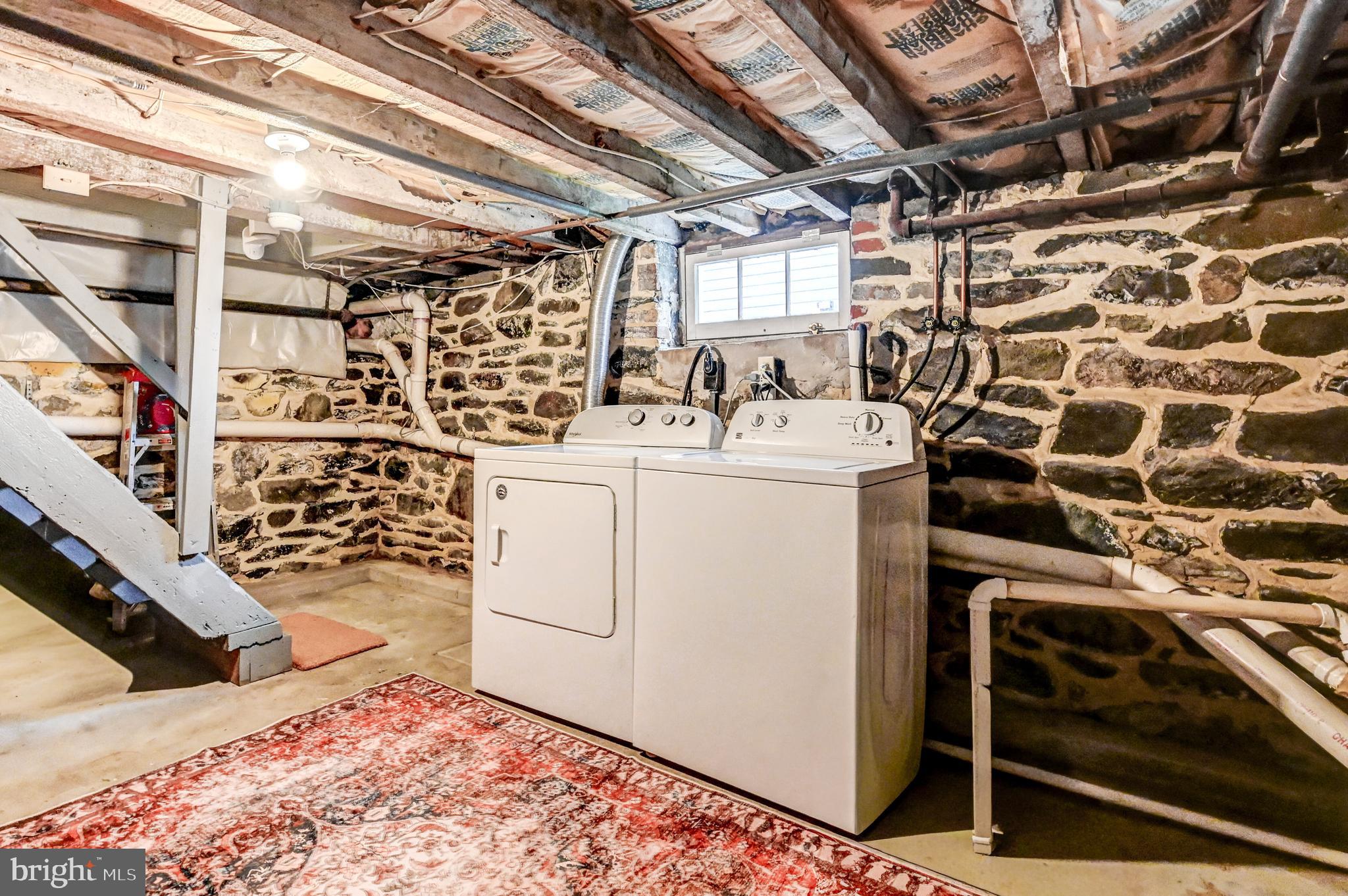 715 Pleasant Hill Road Ellicott City, MD 21043 - Photo 24 of 27 a utility room with dryer and washer