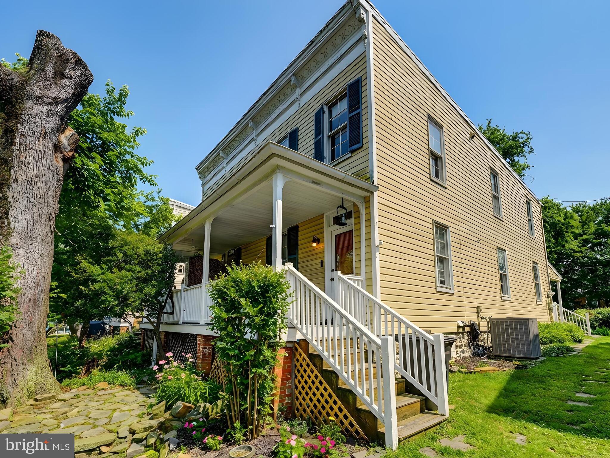 715 Pleasant Hill Road Ellicott City, MD 21043 - Photo 26 of 27 a view of a house with backyard and sitting area