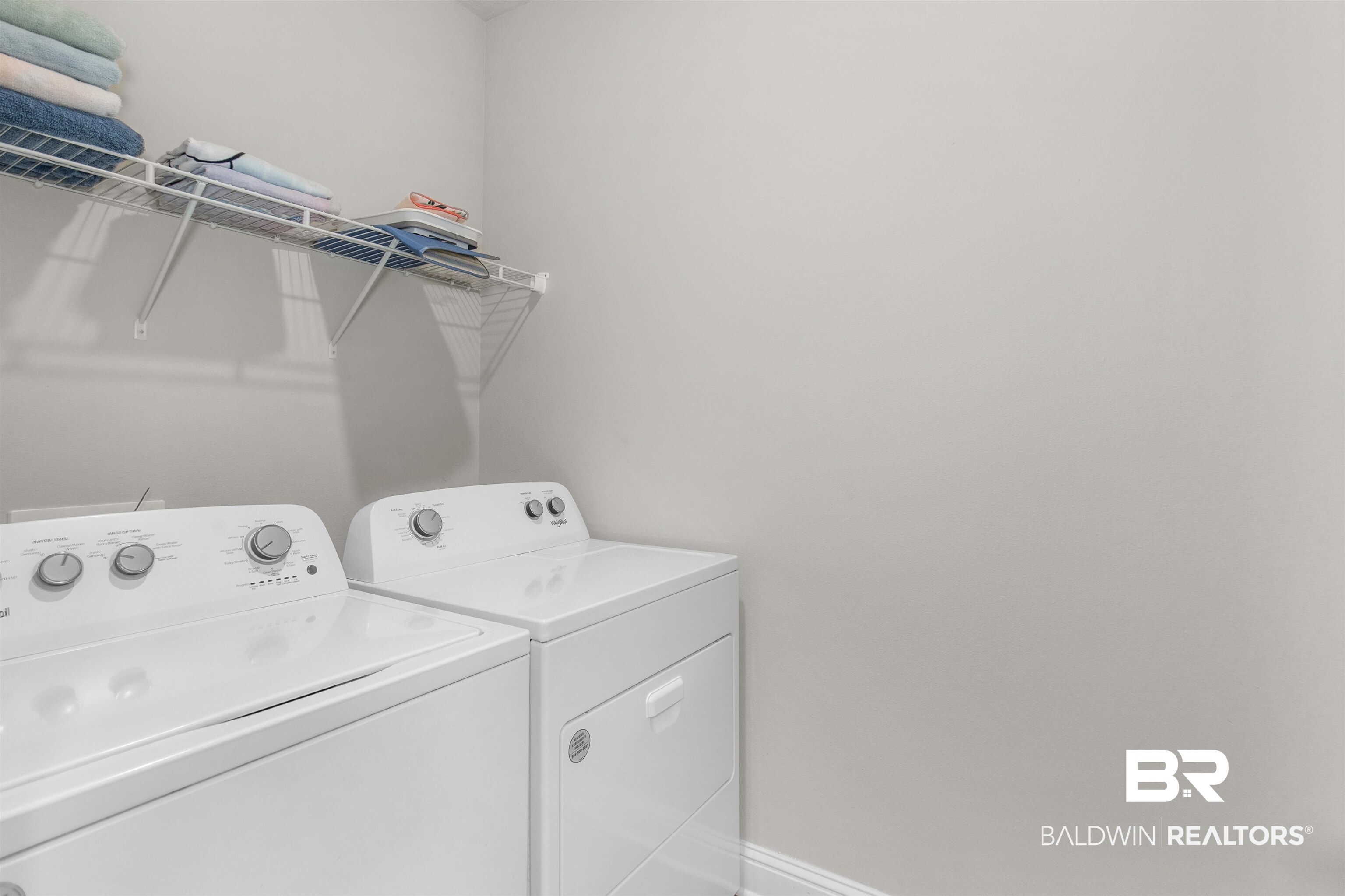 2345 Laurel Street Semmes, AL 36575 - Photo 23 of 31 Washroom featuring washer and dryer and baseboards
