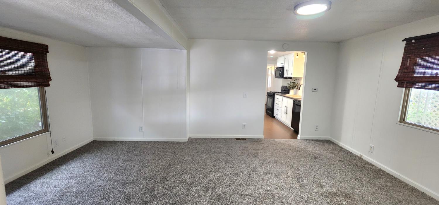 1300 West Olson Avenue, Unit 179 Reedley, CA 93654 - Photo 20 of 39 a view of an empty room with a window