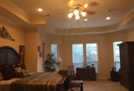 7606 Crystal Isle Lane Humble, TX 77396 - Photo 4 of 10 a bedroom with a bed and large windows