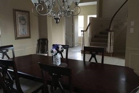 7606 Crystal Isle Lane Humble, TX 77396 - Photo 7 of 10 a view of a dining room with furniture and wooden floor