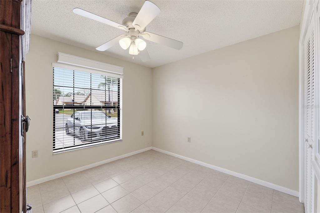 1804 Rising Sun Drive, Unit 1804 Holiday, FL 34690 - Photo 20 of 31 an empty room with windows and fan