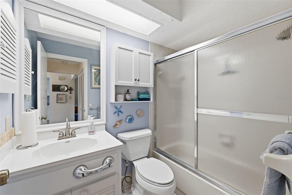 1804 Rising Sun Drive, Unit 1804 Holiday, FL 34690 - Photo 22 of 31 a bathroom with a sink toilet and shower