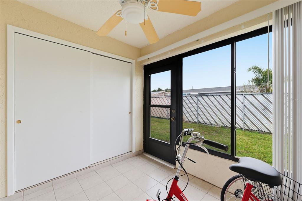 1804 Rising Sun Drive, Unit 1804 Holiday, FL 34690 - Photo 25 of 31 a bedroom with sliding door and a window