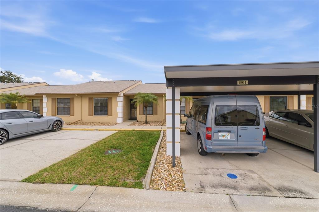 1804 Rising Sun Drive, Unit 1804 Holiday, FL 34690 - Photo 5 of 31 a car parked in front of a house