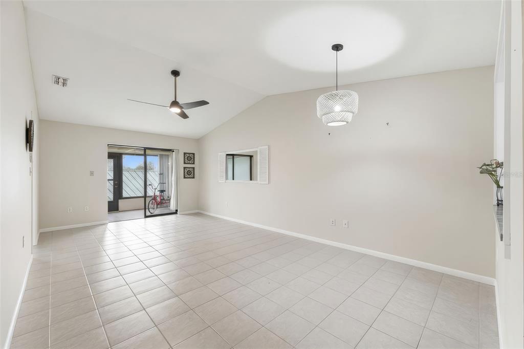 1804 Rising Sun Drive, Unit 1804 Holiday, FL 34690 - Photo 7 of 31 a view of an empty room with window and chandelier fan