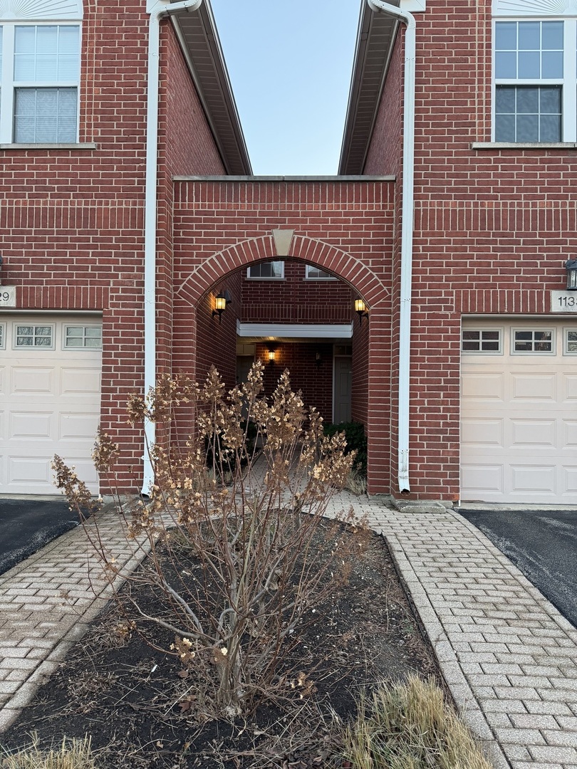 1137 Brent Road Northbrook, IL 60062 - Photo 2 of 25 a view of a house with a small porch