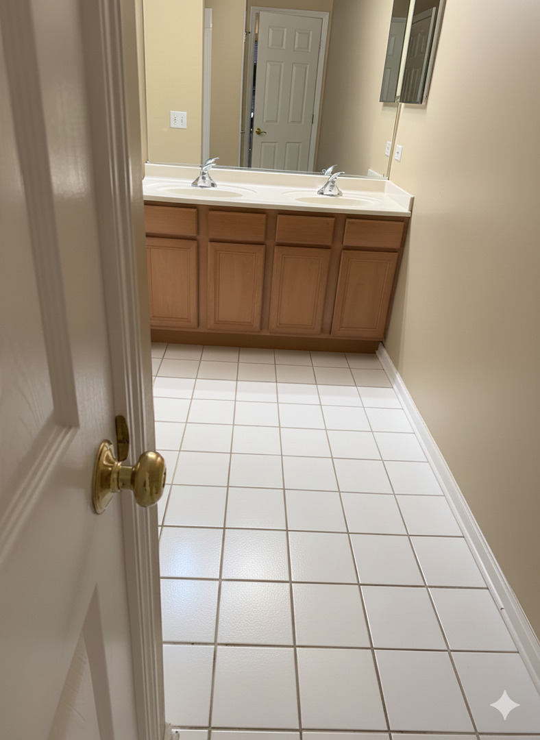 1137 Brent Road Northbrook, IL 60062 - Photo 21 of 25 a bathroom with a sink a toilet and a mirror