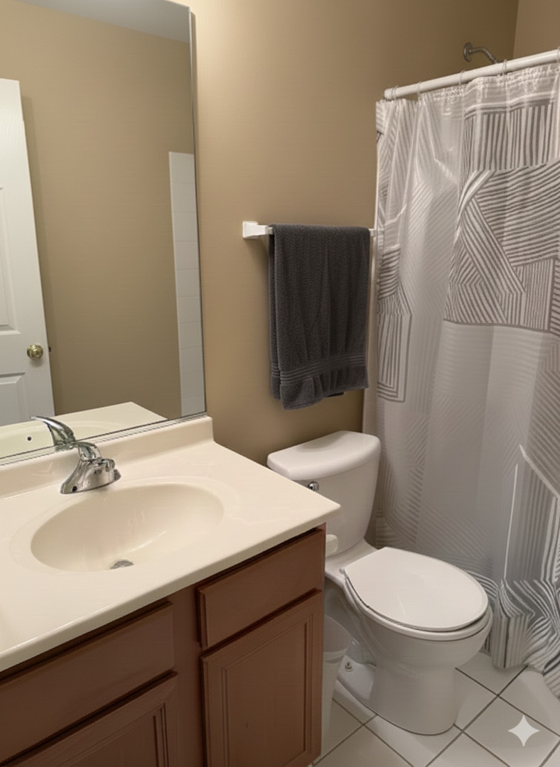 1137 Brent Road Northbrook, IL 60062 - Photo 22 of 25 a bathroom with a sink a toilet a mirror and shower curtain