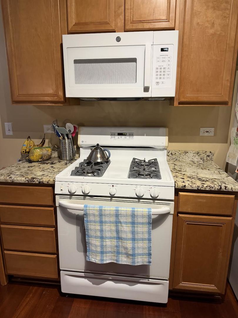 1137 Brent Road Northbrook, IL 60062 - Photo 6 of 25 a kitchen with a stove and cabinets
