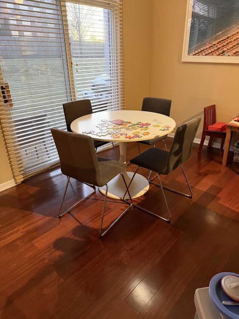 1137 Brent Road Northbrook, IL 60062 - Photo 9 of 25 a view of a dining room with furniture and wooden floor