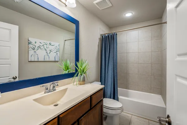 a bathroom with a sink a toilet and a bathtub