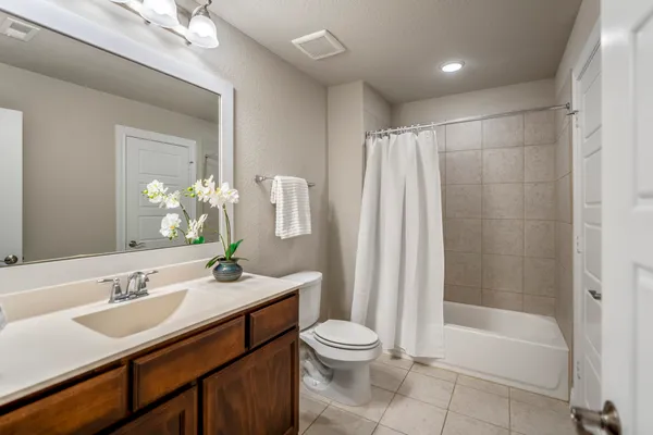 a view of a backyard with wooden fence