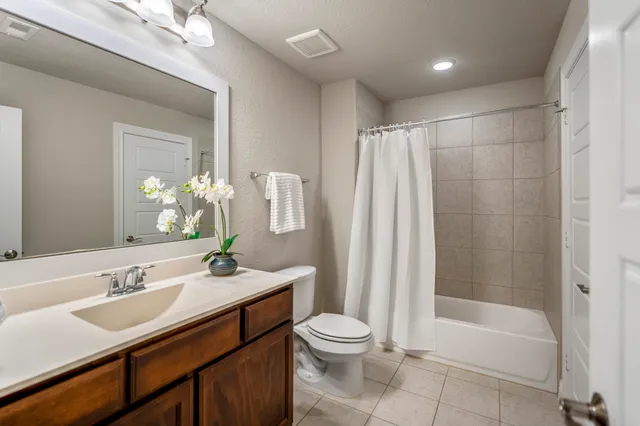 a view of a backyard with wooden fence