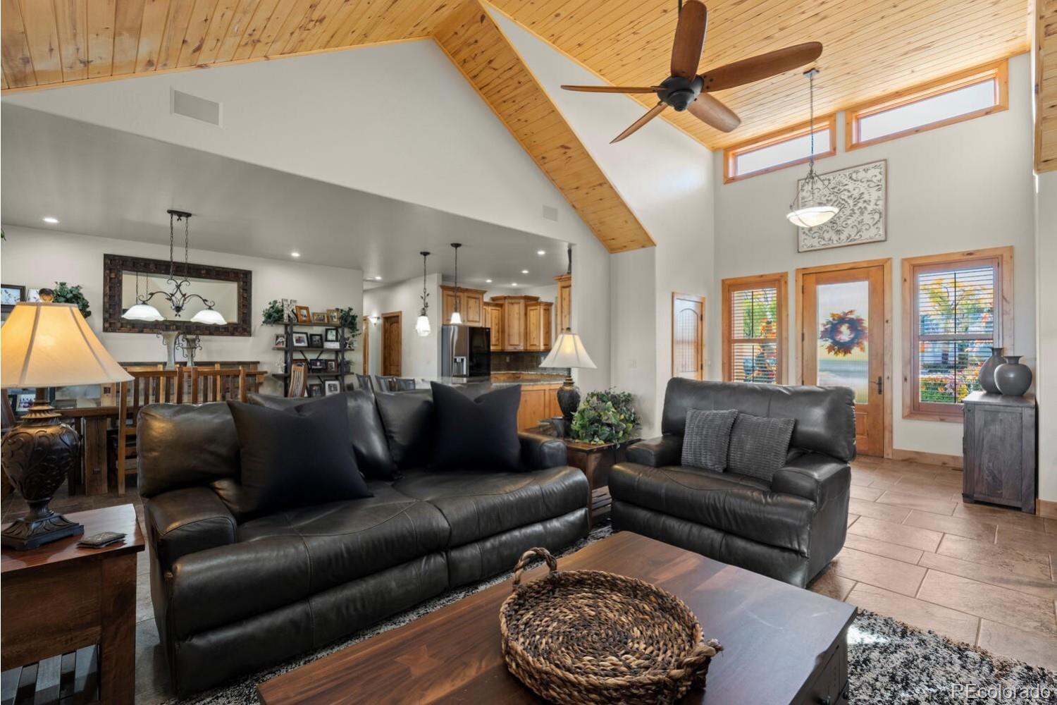 60075 Oak Grove Road Montrose, CO 81403 - Photo 11 of 50 a living room with furniture a rug and a fireplace